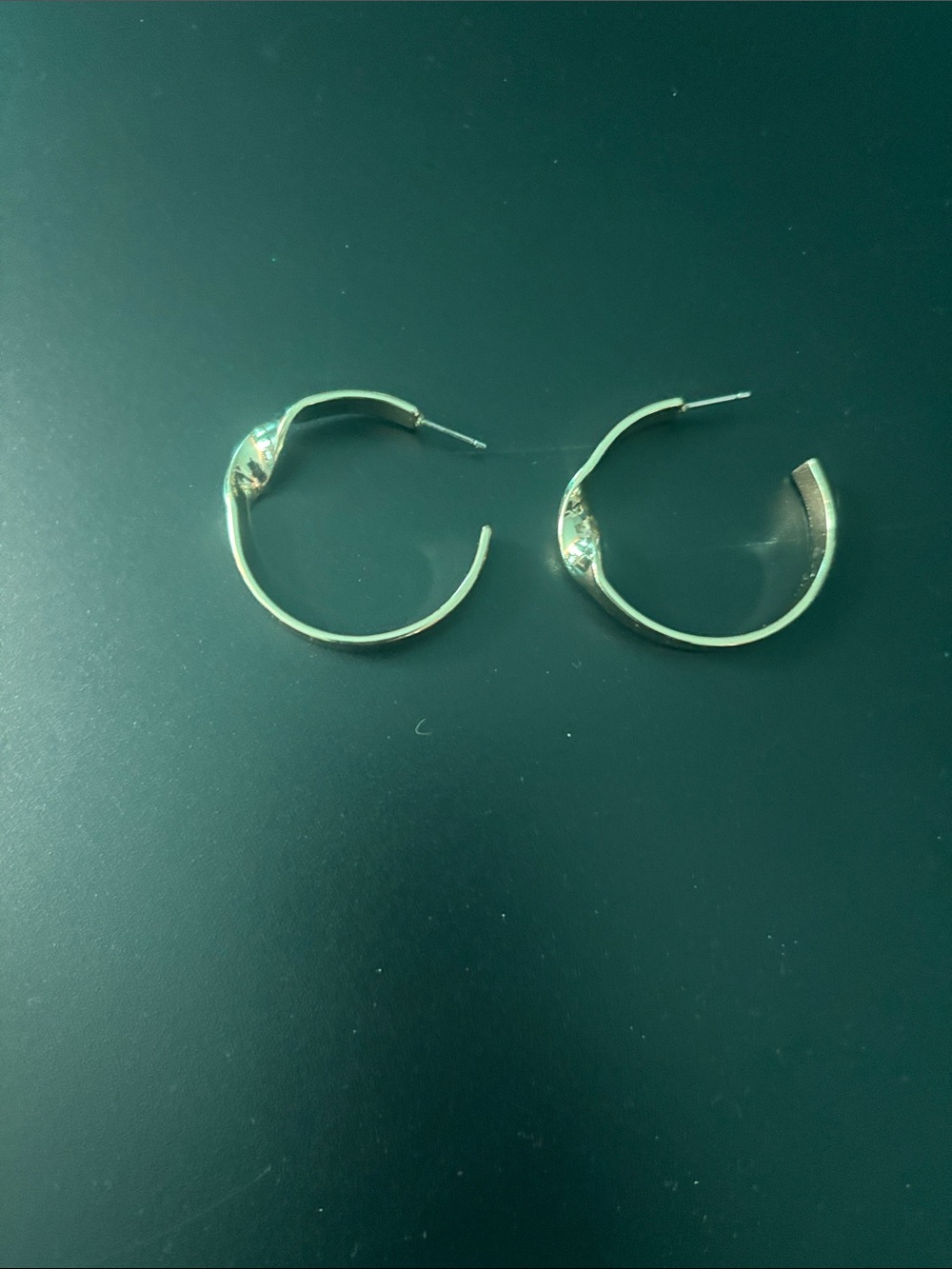 Smooth Gold Hoop Earrings with Subtle Faceted Detail